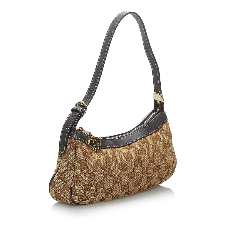 Women Gucci bags with a chain - link trim and a leather bodyGucci GG Canvas Baguette (34048)