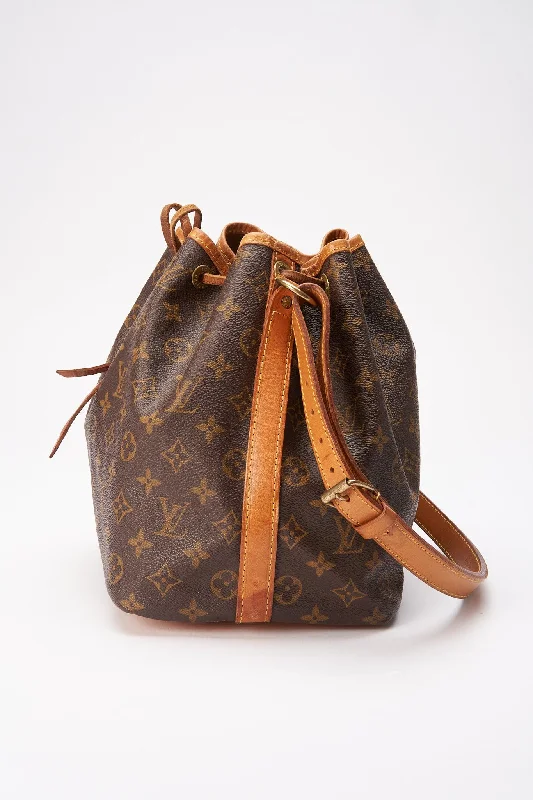 Louis Vuitton bags with a snap - button closure and a decorative charm for styleLouis Vuitton Petit Noé Bag in Monogram Canvas