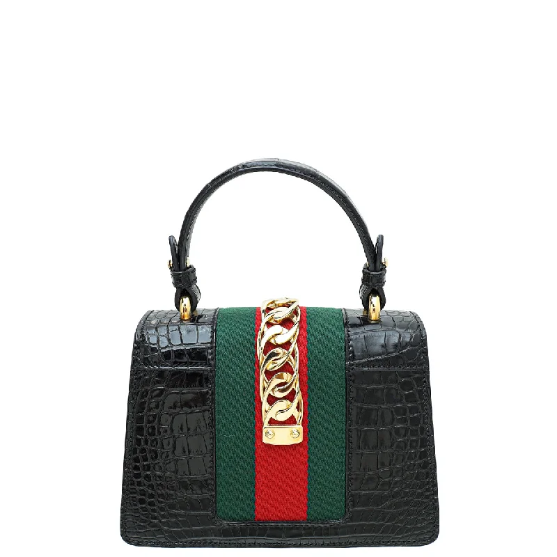 Ladies Gucci Dionysus bags in a pastel colorGucci Shiny Black Alligator Sylvie Mini Top Handle Bag