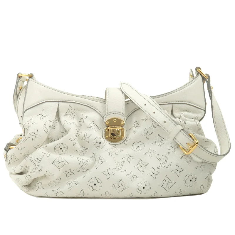 Ladies Louis Vuitton Petite Malle bags in a pastel color for a soft lookLouis Vuitton Monogram Mahina XS 2Way Hand Bag Blanc M95660